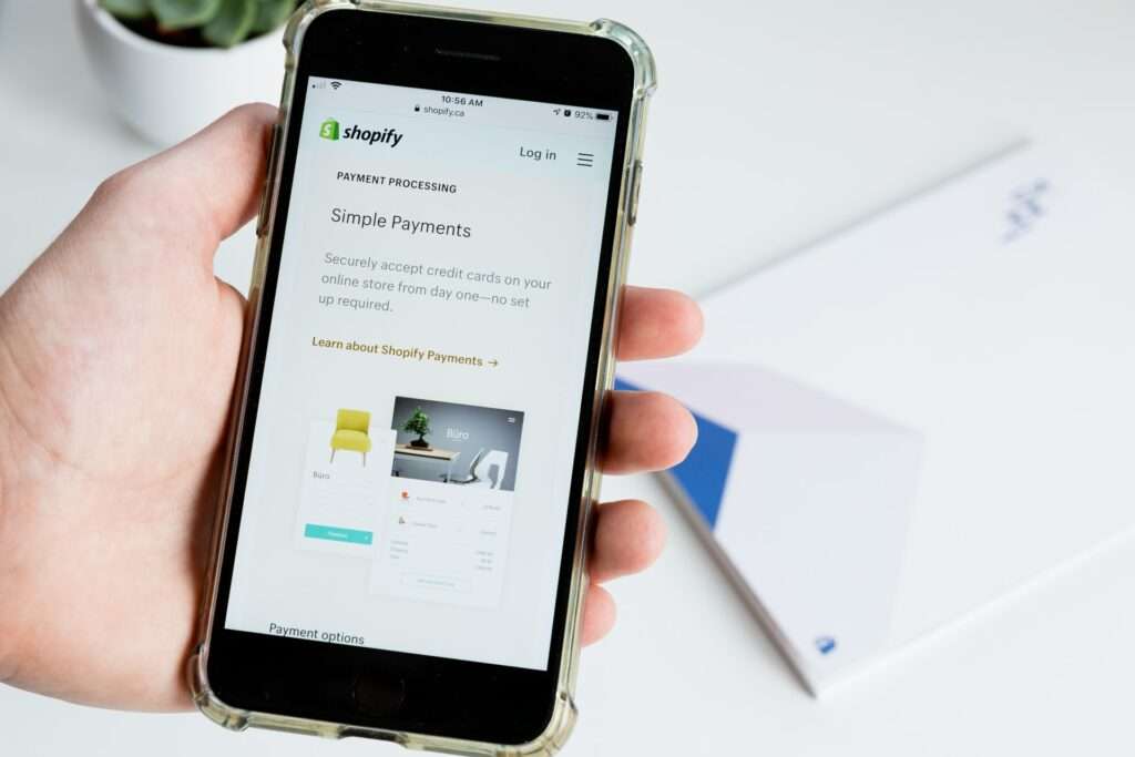 person using shopify on iphone